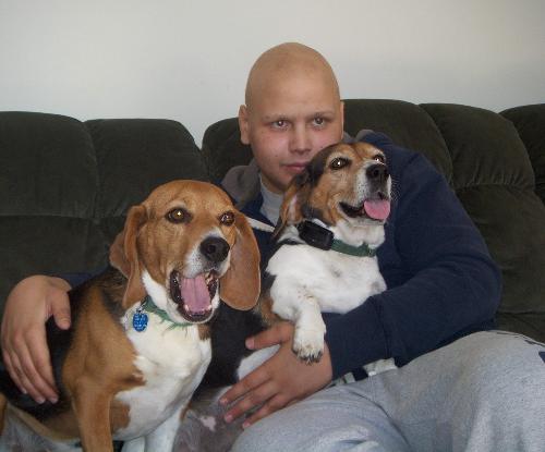 Tyler with his dogs when he first got home from the hospital.