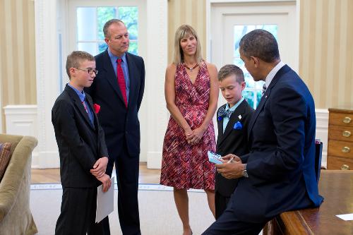 Mr. Obama signed Calvin's artwork and is now admiring Klaus' painting. "USA" letters shaped from Lego pieces.