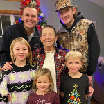 Cindy with all of her grandkids at Christmas time