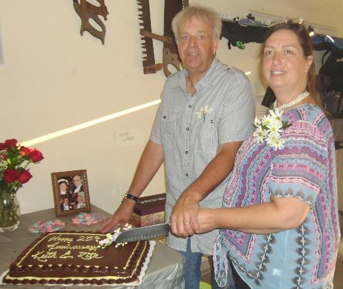Cutting the cake on 25 years of marriage.