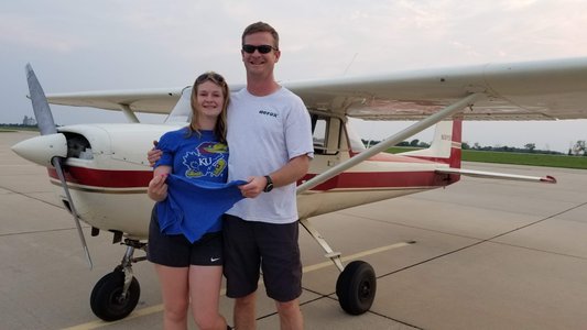 Her first solo flight! Dad cut out the back of her shirt per FAA regulation (tradition)!