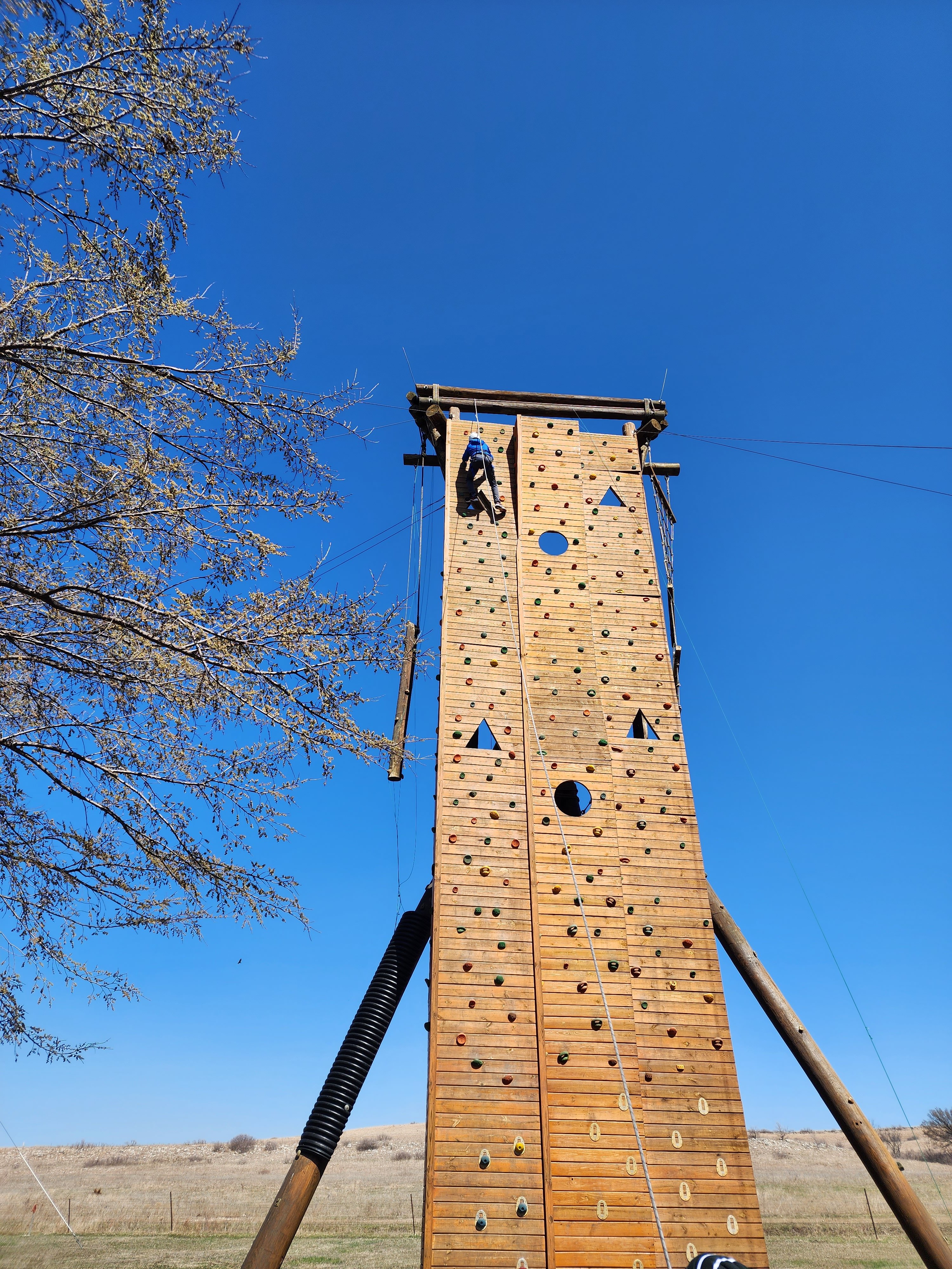 Caleb fearlessly scaled a climbing wall at Camp Wood during a KSSB Weekend event!