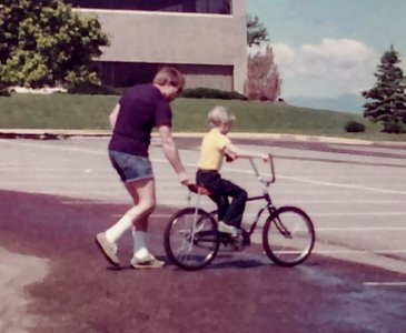 John teaching Neil how to ride  - Centennial CO 1982