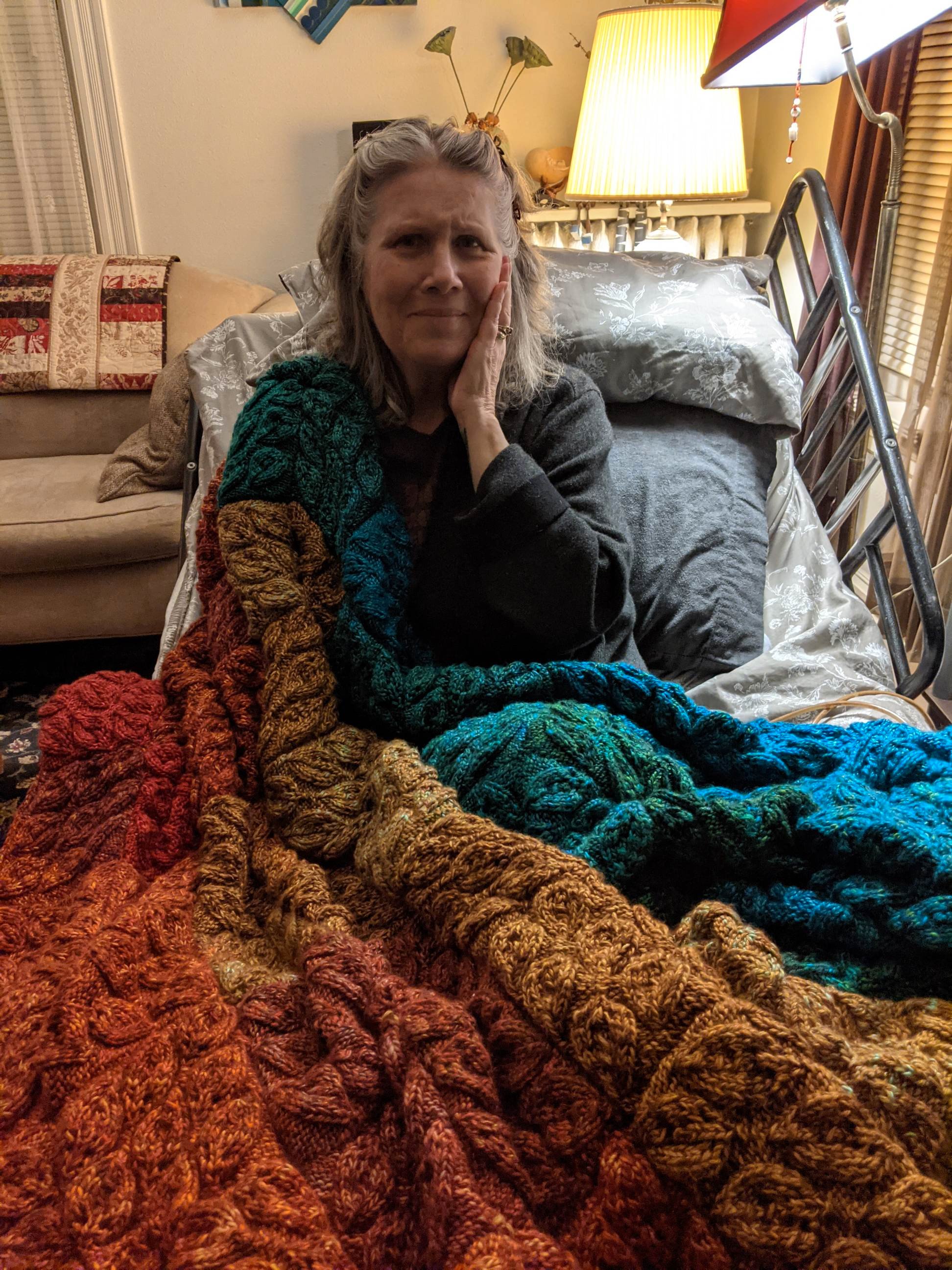 Laura’s hand knit silk and alpaca leaves transformed into this magical quilt  by a group of marathon knitters.