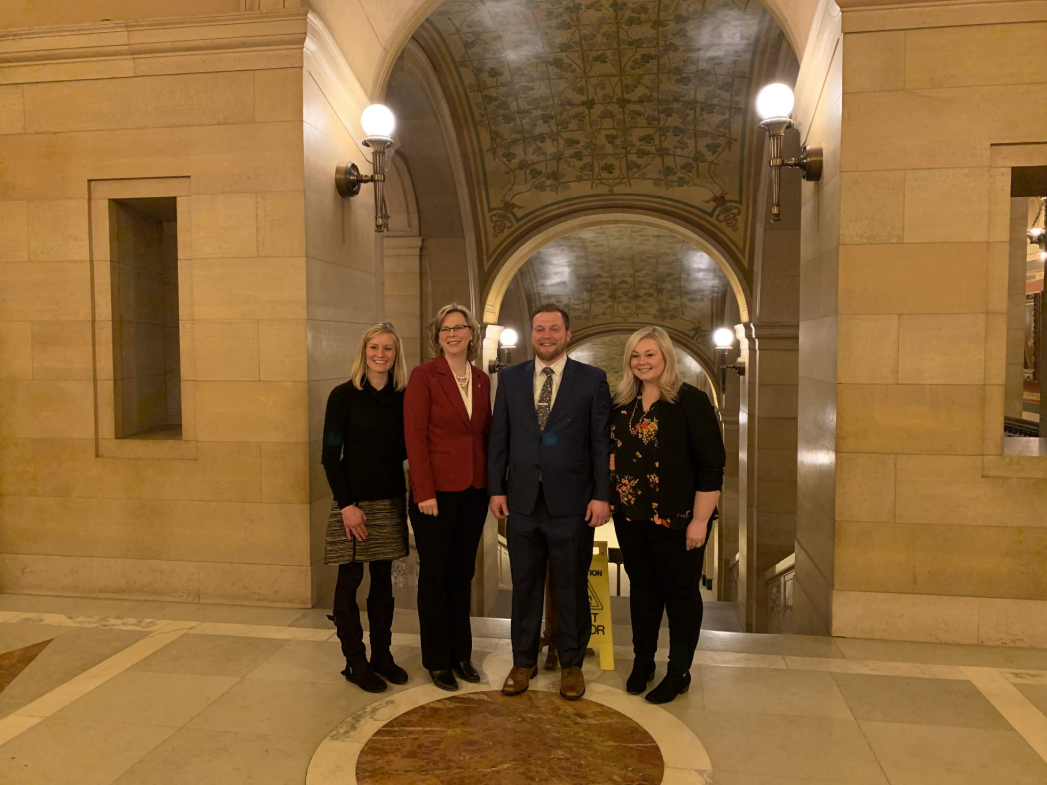 Lorna Schmidt, Representative Julie Sandstede, Andrew, and Ashley after their first testimony at the State Capitol.