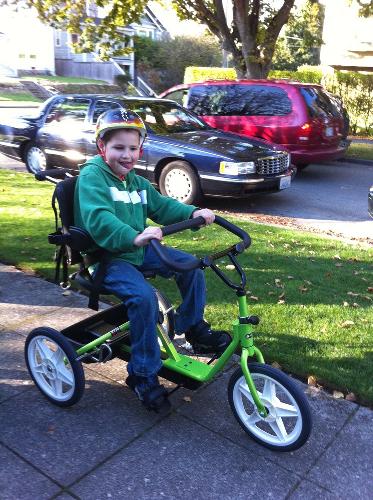 New Rifton tricycle! Elijah can now ride bikes with his brother!
