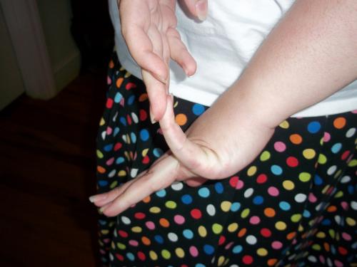 Pinkie finger pulled back...Can you do this?  You get one point for each little finger.