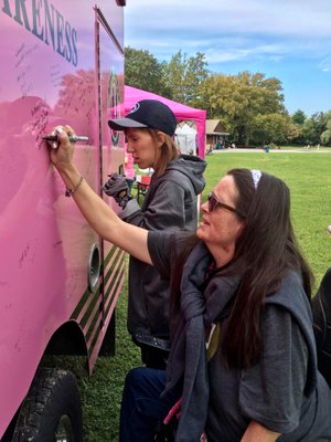 We signed a Pink Ambulance that delivers hope