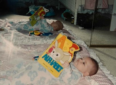 Melanie always loved to read. She was literally four months in this photo!