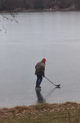 I still got it on the ice, here's where I fish, old guy crossing.