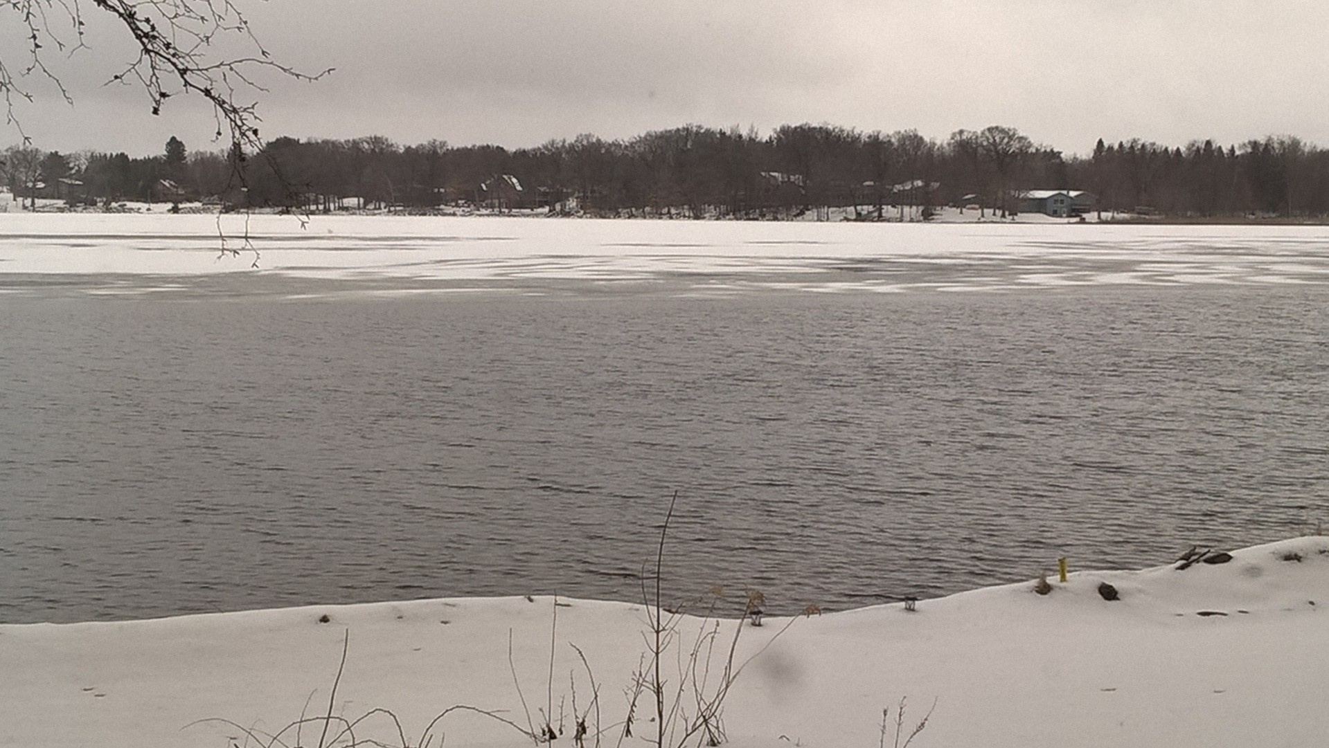 Ice going out on the lake, even during a snow storm.
