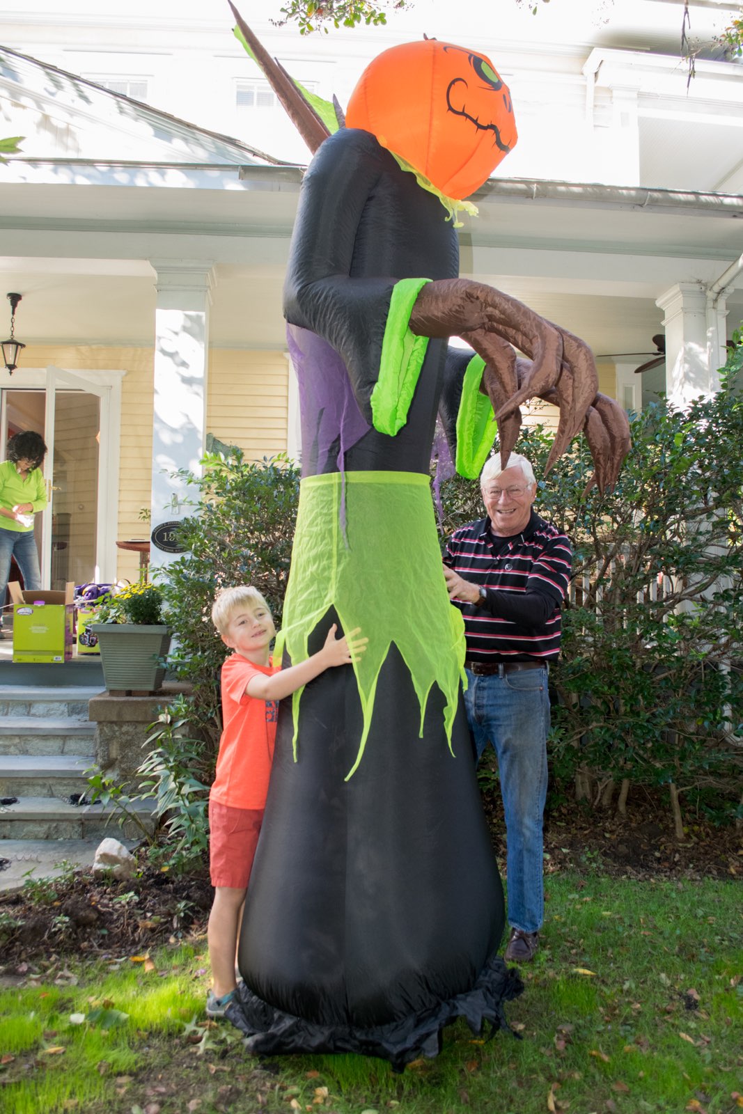 Neighbor and adopted grandkid Wyatt helping Mr. John and Mrs. Beth decorate for Halloween.  