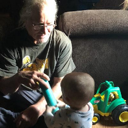 Dad loves spending time with his grandkids. And they are always completely captivated by him. 