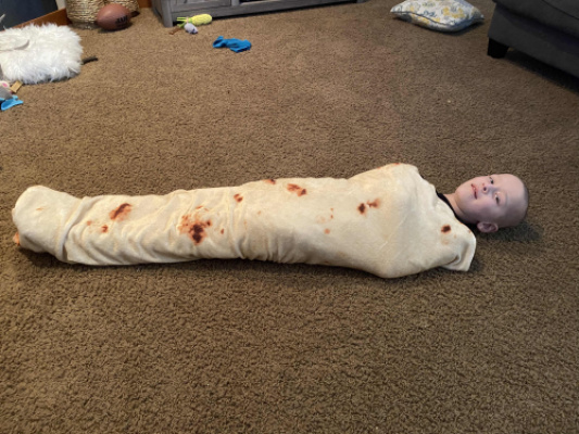 It’s a Conner-ito! He got a burrito blanket Christmas and he loves playing in it.