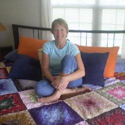 Me, and the beautiful quilt lovingly created by my new sister, Mary