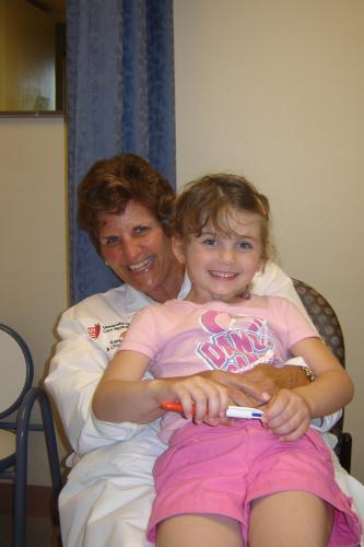 Erin with Nurse Barb - one of our many heros!  We LOVE her very much.  She knows a TON about Erin.