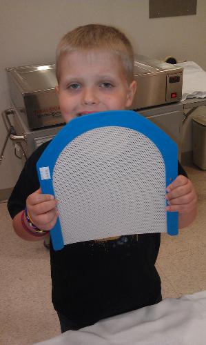 This is what they will make his radiation mask out of. They warm it and it stretches over his face.