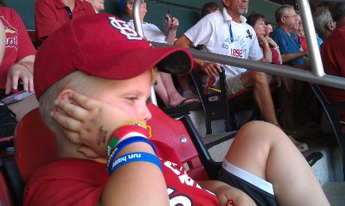 Chillin' at the Cardinals game with ice under his hat and around his neck:)