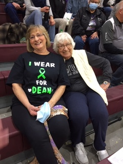 Carla and Hilda enjoying the basketball game but thinking of Dean.  Thanks!