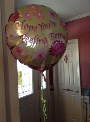My balloon from a couple sweet friends {the balloon has flowers on it and says "Hope You're Feeling Better"}