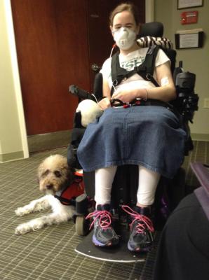 Waiting in the orthotist's office.  {sitting in my wheelchair and Ezra lying by my side}