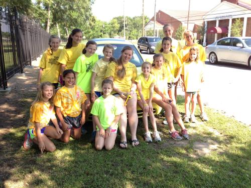 Morgan, the YELLO club, and the yellow bug awaiting the St. Jude's Memphis-to-Mobile runners 