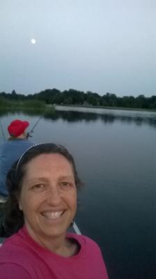 Keith fishing, me paddling, in our canoe all by full moon the end of June.