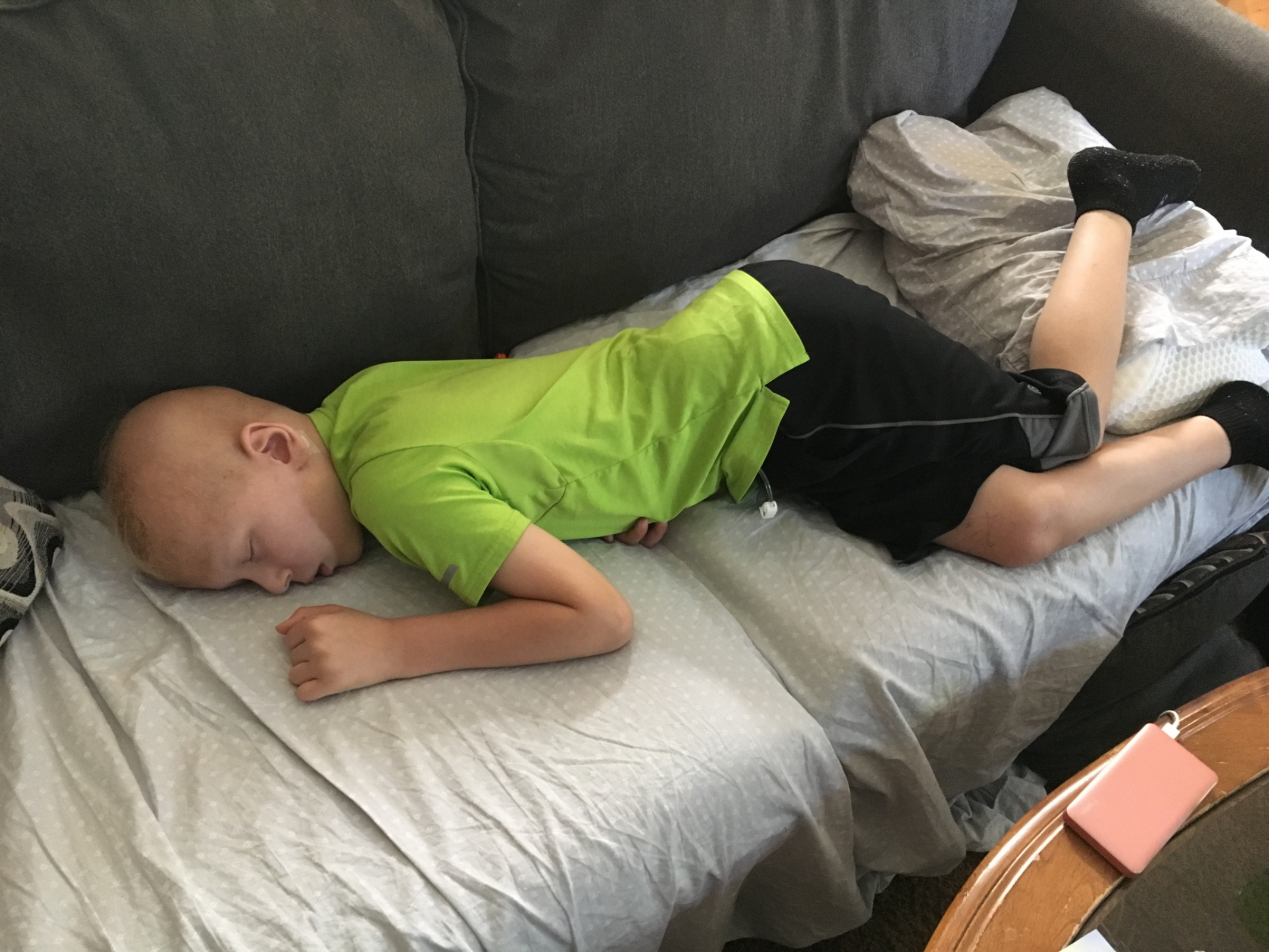 Conner said he was going to clean his Gtube site in order to watch tv. As he said this I was walking into our bedroom. When I came out I found him like this, zonked out on the couch.