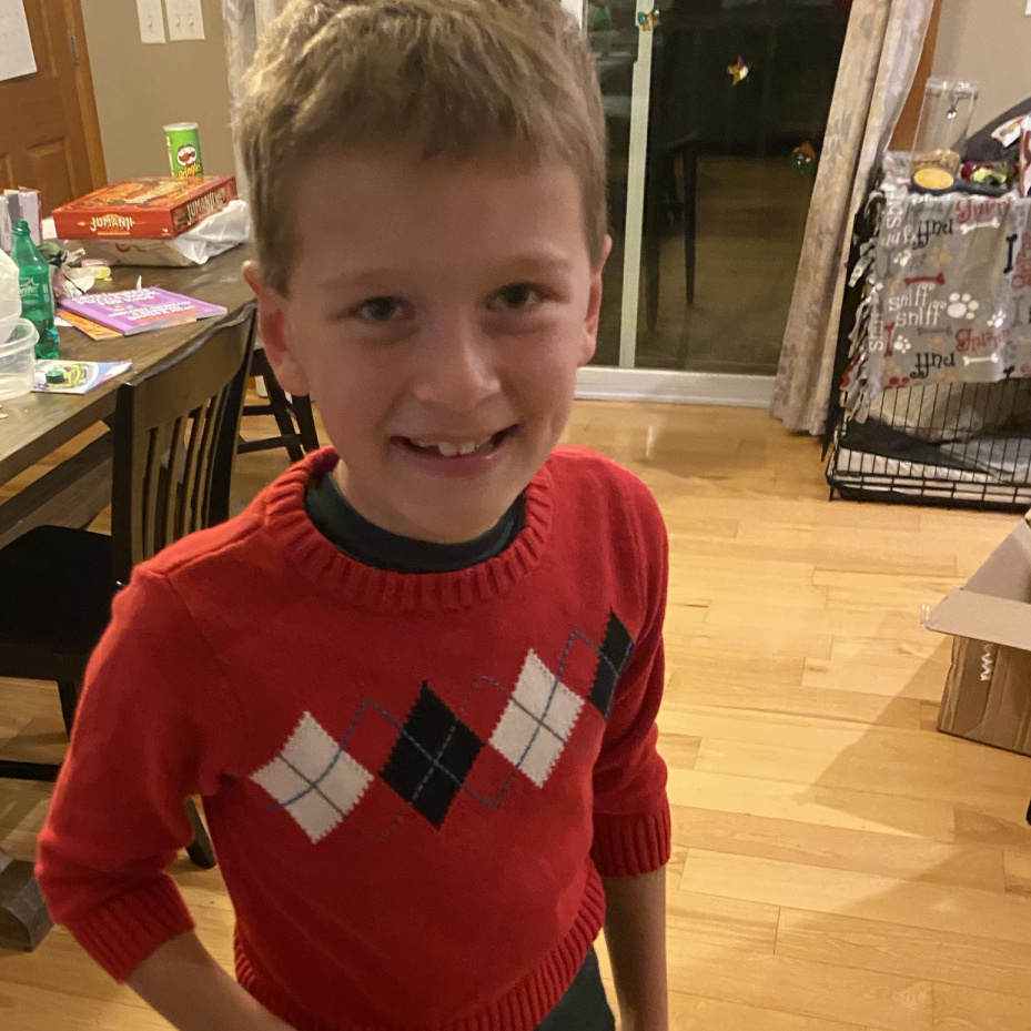 This is his sweater from about 4 or 5 Christmas' ago. He says it's from his 'babyhood'. How cute is that!?!