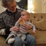 Grandson Arlo's first piece of lefse, shared with his GrandDan.