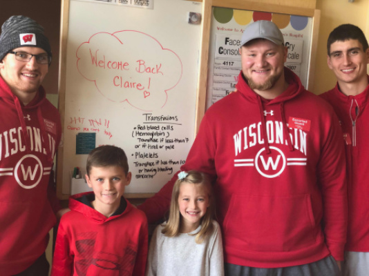 UW Badger Football players visiting with Claire and Gavin.