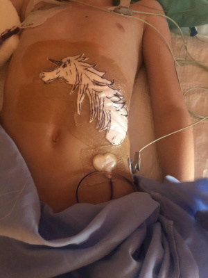 Dr. Le has quite the reputation for his elaborate post surgery bandages. Claire sporting a unicorn on her abdomen hours after surgery. Pic 2/7/2020