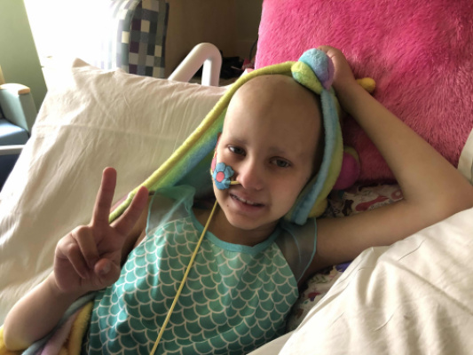Claire holding up a “2” for her second Stem
Cell Transplant/Rescue. 5/21/2020