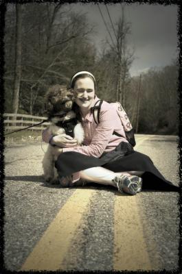 Sitting in the middle of the road, hugging my sweet Ezra who is 2 seconds away from covering my face with doggy kisses :) 4/15/14