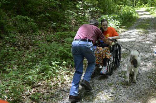 One (and only) way to get back up a hill in a manual wheelchair... Daddy pushing the front of my wheelchair and going backwards up a hill with Ezra trying to figure out how to walk beside me when I'm going the opposite direction :)...5/28/14 - family vacation 2014