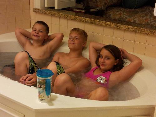 Cousins (3 of our 4 grandkids) relaxing before bedtime in the Jacuzzi tub in the Master bedroom.
Left to right: Kyle 6, Gavin 12, Gabby 9.
 
 