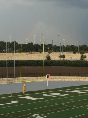 at the first in season game tonight...Sent from a football mom: Another rainbow... Shining above the field.  God is watching , providing and loving u all days and all the way 