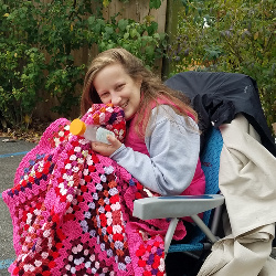 This handmade blanket gives Emma great comfort. It was handmade by a very talented lady of our Church Family, each stitch made with love and prayers. She is using it today as she receives her 8th of 12 chemo treatments.