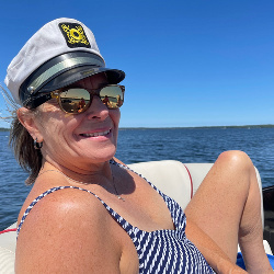 Katie at her happy place- on the lake.