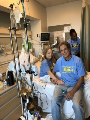 Ben and I during CAR-T cell reinfusion today. The little bag at the top of the iv pole is my CAR-T cells dripping in. My nurse today, Michel, in the background, actually has my same birthday in November. Very interesting...