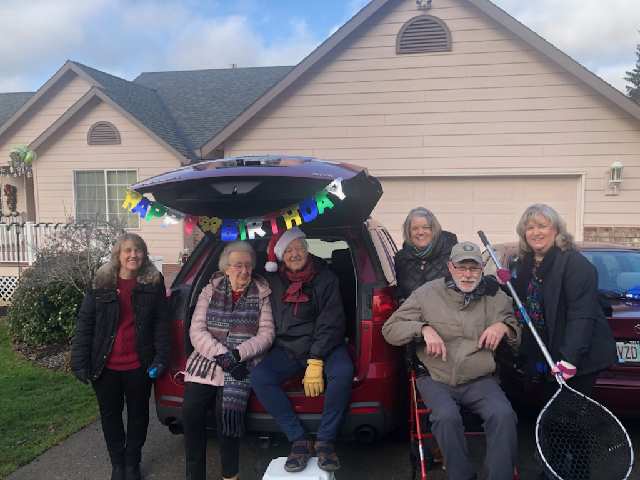 Birthday greeters - COVID style celebration - drive by 'open house'.  Dip net to receive cards and give out treats.  L to R, Pam Newby, Roberta Petersen, Dan the birthday boy, Cindy and Steve Pollard, Julie Petersen