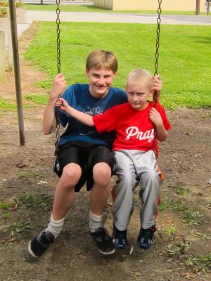 Swinging with his brother