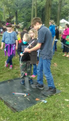 Learning archery at Johnny Appleseed Festival