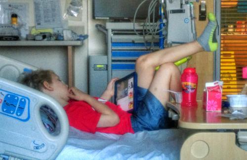 Hospital life:  relaxing with the iPad while eating breakfast