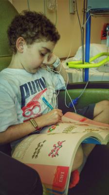 Doing a little math while getting his infusion at Lutheran