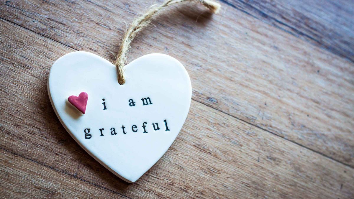 heart ornament with "i am grateful" written on it.